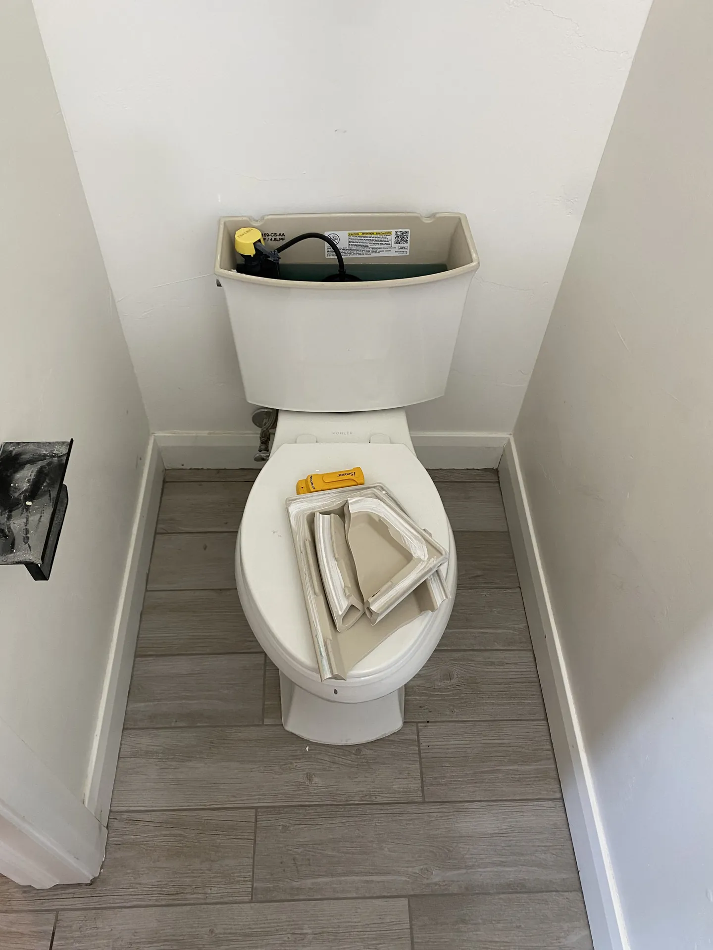 Finished bathroom tile around toilet — clean grout lines and proper fit