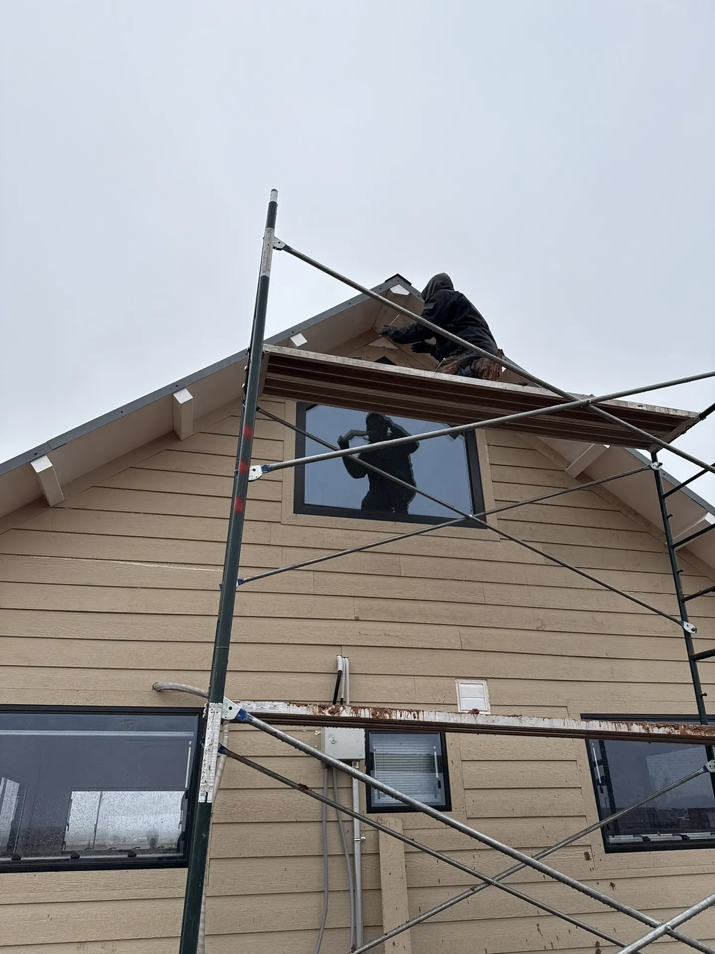 Siding detail work at the gable peak — Viking Solutions Boxabl project in Hurricane Utah