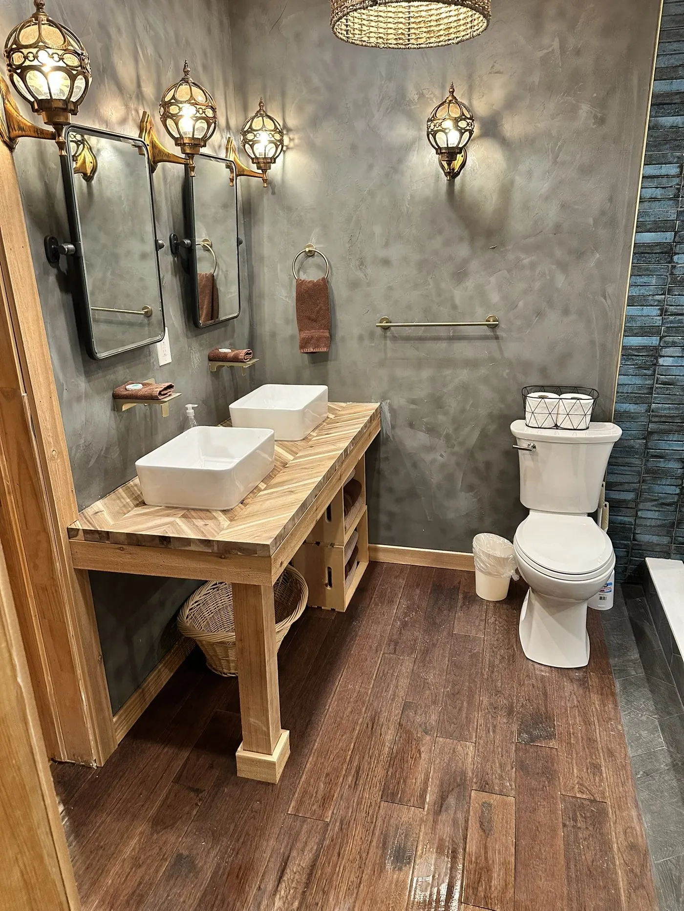 Completed bathroom remodel by Viking Solutions — custom vanity with Moroccan sconces in Washington County Utah