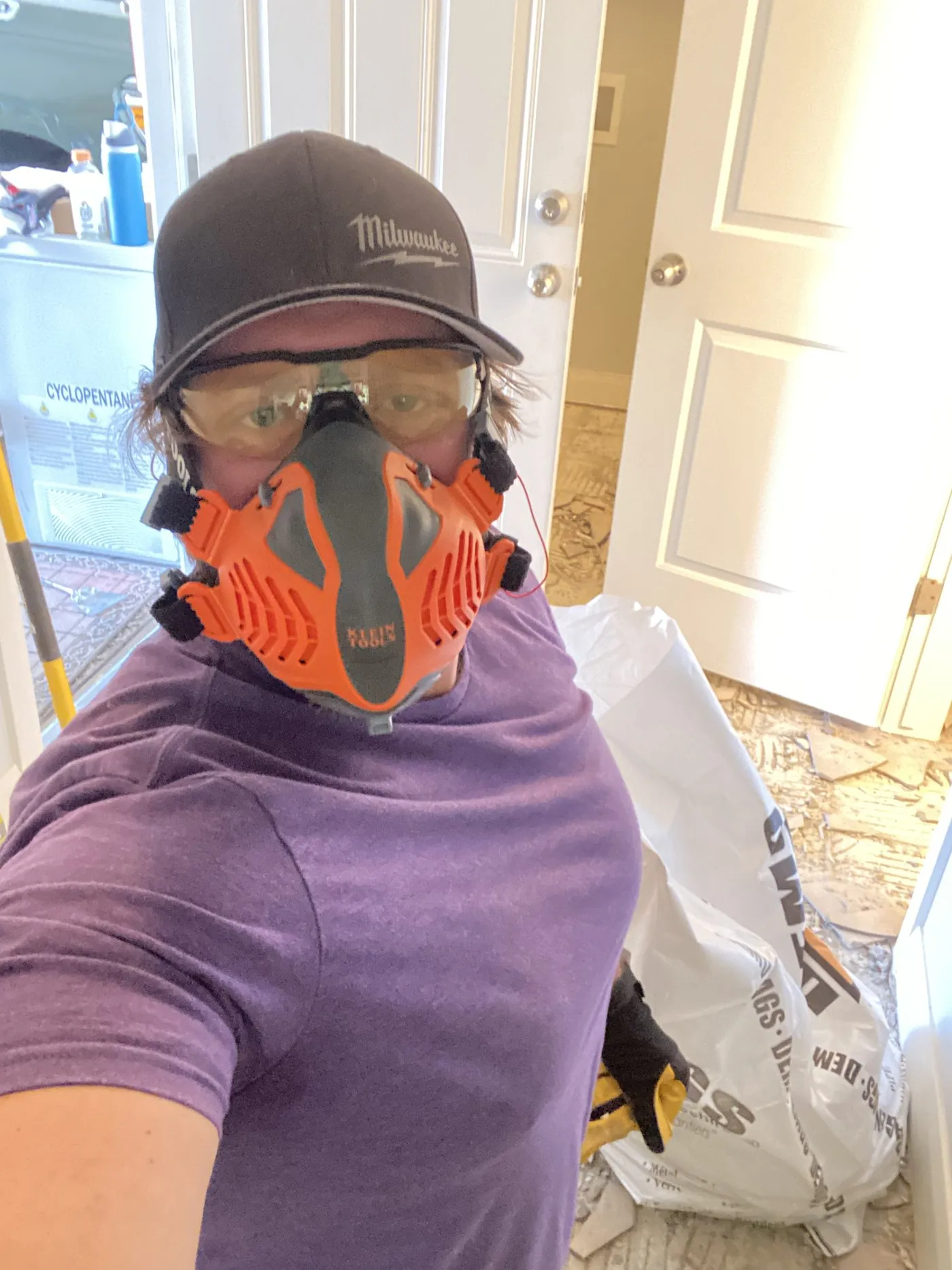 Creed, co-founder of Viking Solutions, wearing a respirator mask on a dusty demo job in Washington County Utah