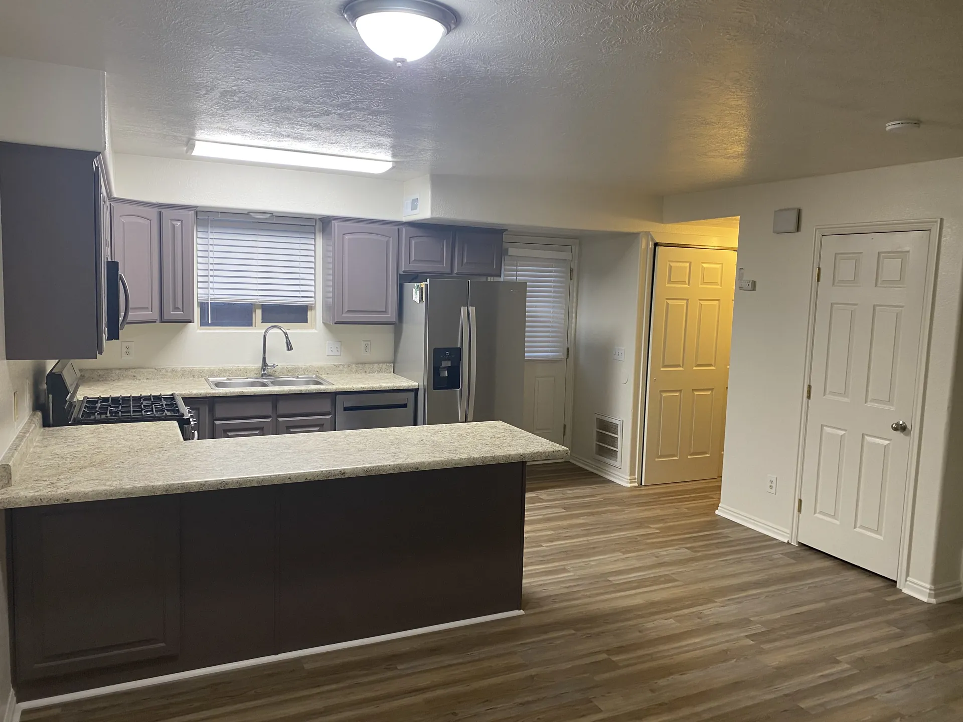 Finished kitchen and living area after full apartment remodel — St. George, Utah