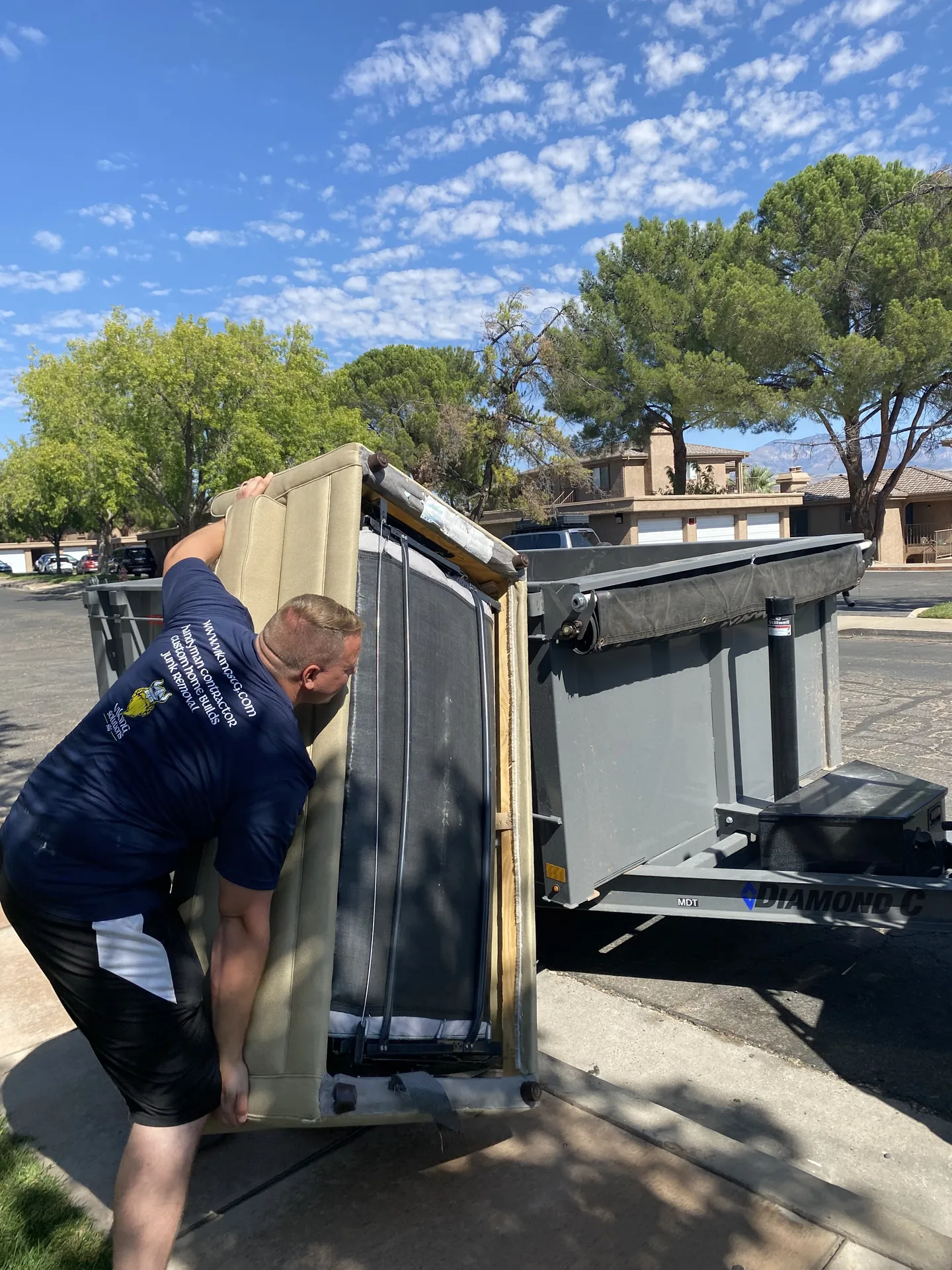 Viking Solutions crew hauling out old furniture and debris during the apartment refresh