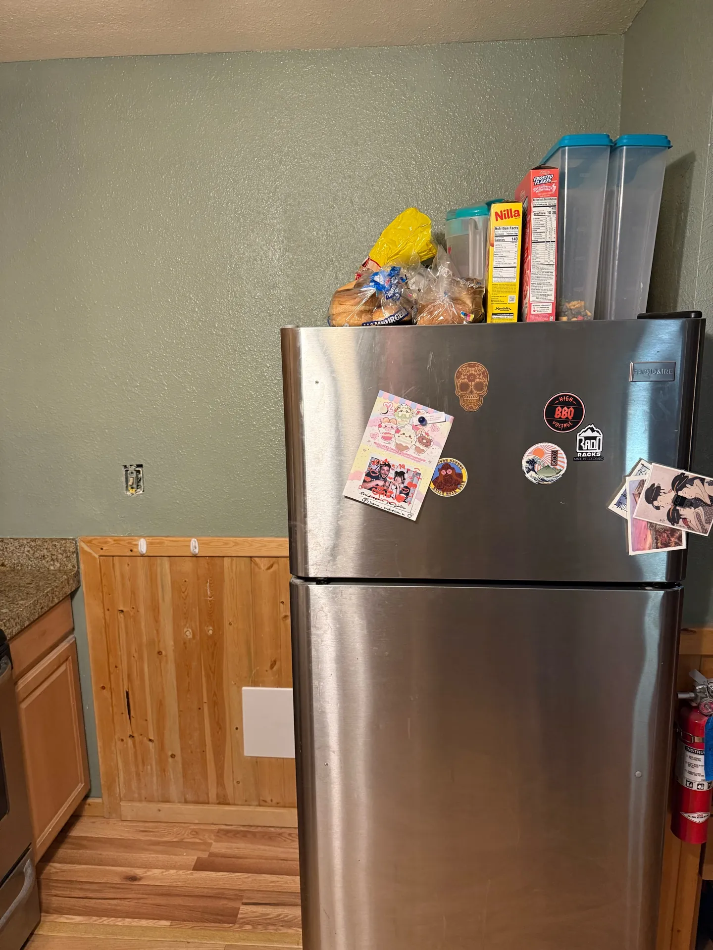 Brian Head kitchen repair — refrigerator back in place, wainscoting complete, wall fully repaired and painted