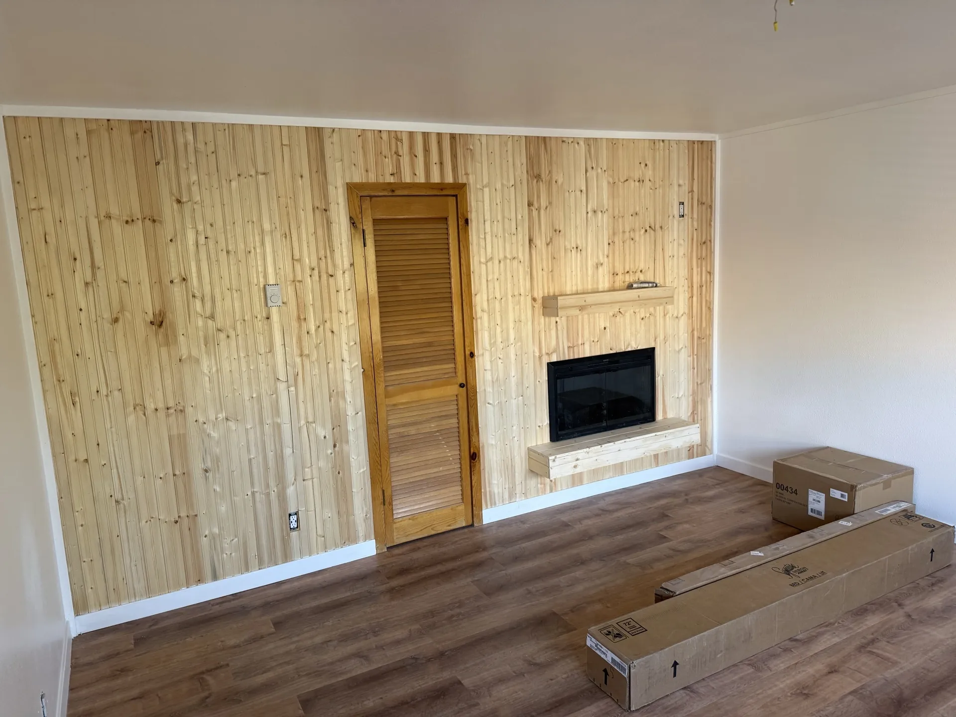 Brian Head studio before remodel — dated interior with worn flooring and original finishes