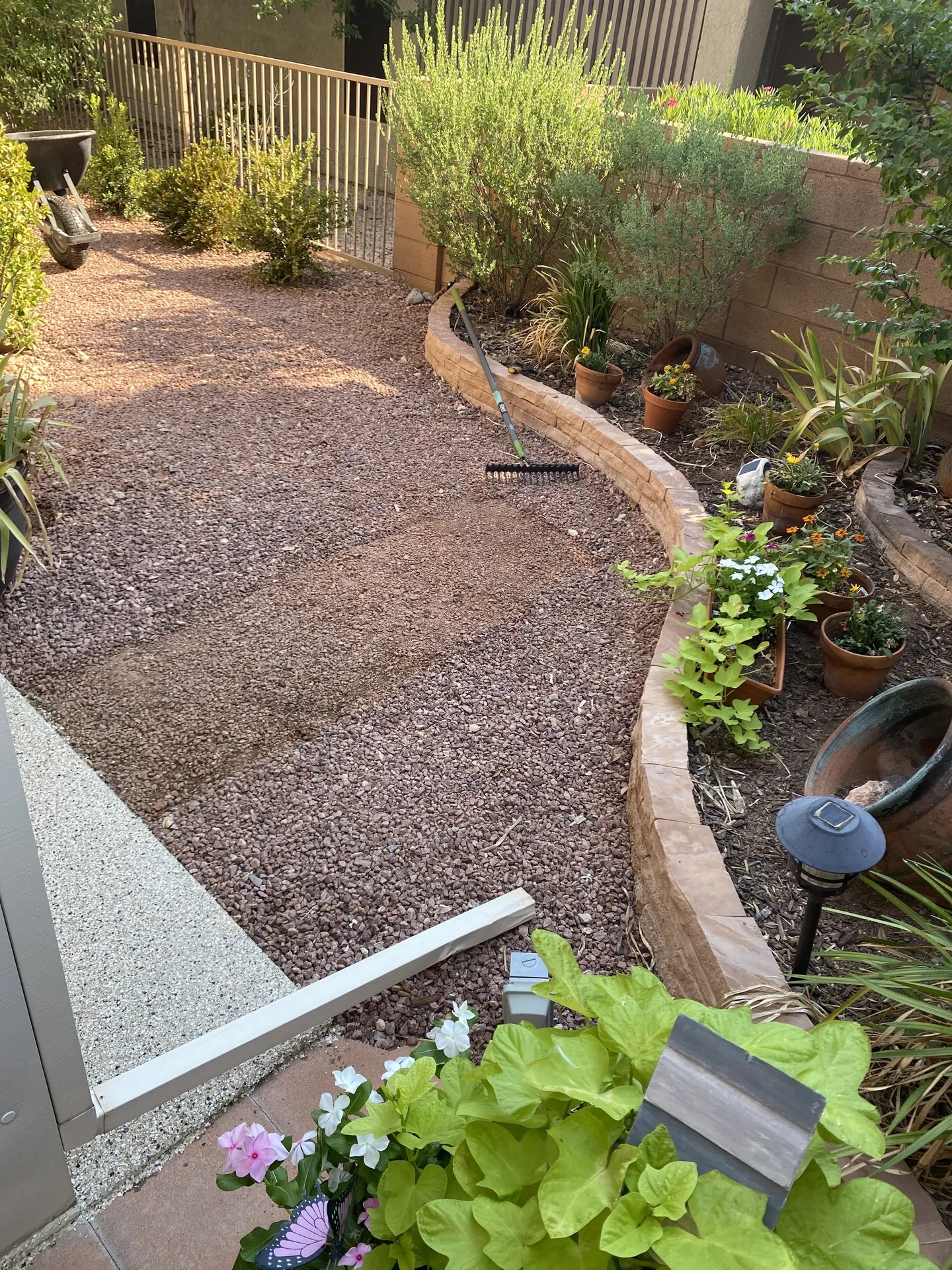 Before: gravel ground in St. George backyard before artificial turf installation